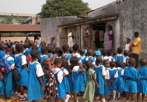 Hundreds of primary school children in blue uniforms gathered for a 3E Foundation Love of Mathematics outreach event in Nigeria